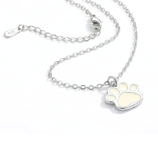 Silver necklace with a paw-shaped pendant on a white background